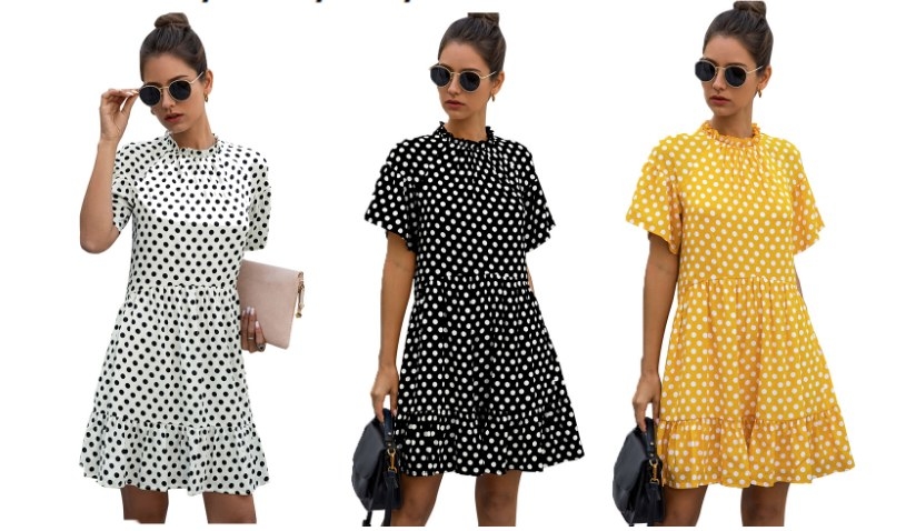 A model wearing one mini, ruffle-frilled polka dot dress in white/black dots, one in black/white dots, and one in yellow/white dots