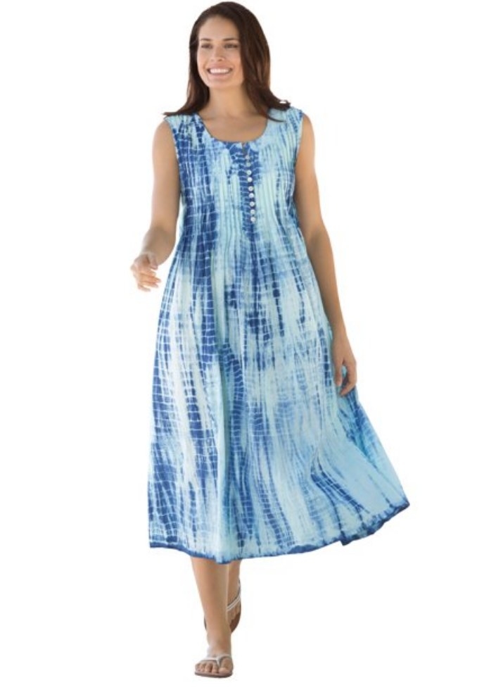 A model wearing a sleeveless, blue tie-dye midi dress
