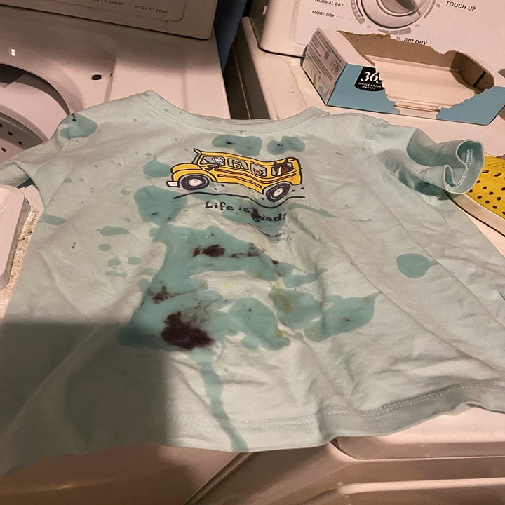 Reviewer's before photo showing their child's stained shirt