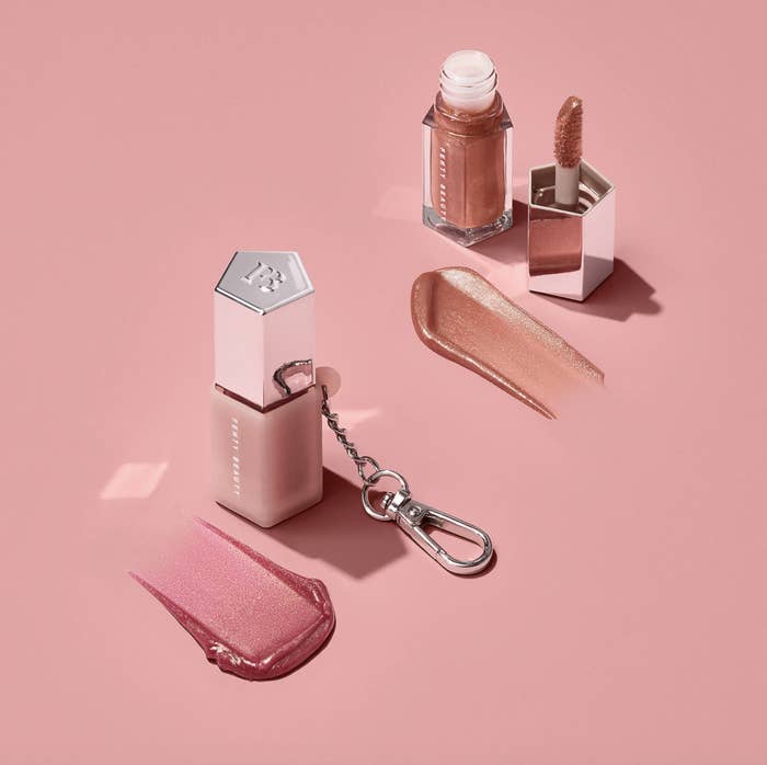 The glosses: one rosey nude pink and one pink, both with shimmer
