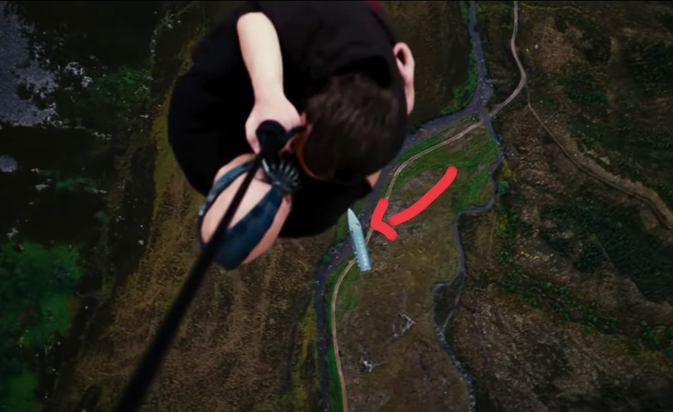 what remains of the CIA plane falls as Bane hangs from his mercenaries' plane