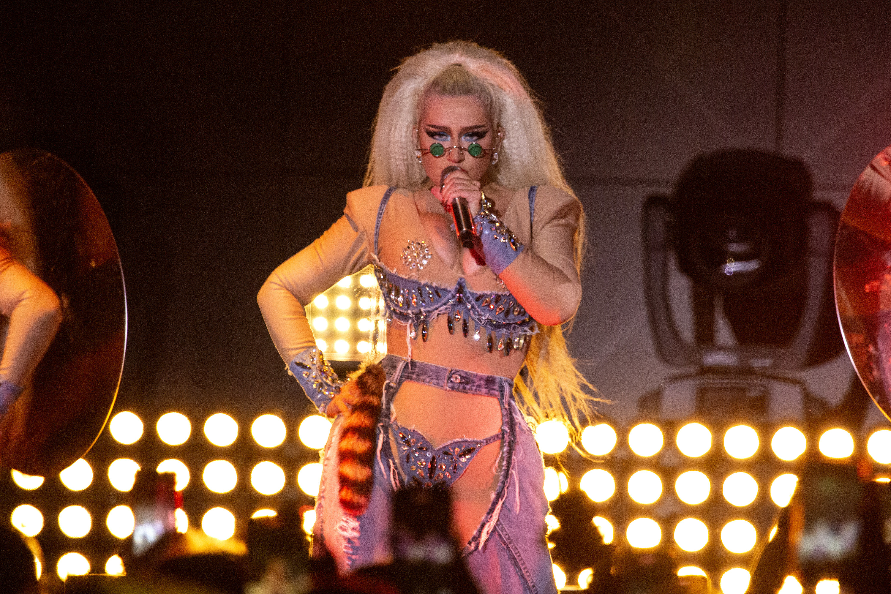 Christina Aguilera singing in a bodysuit