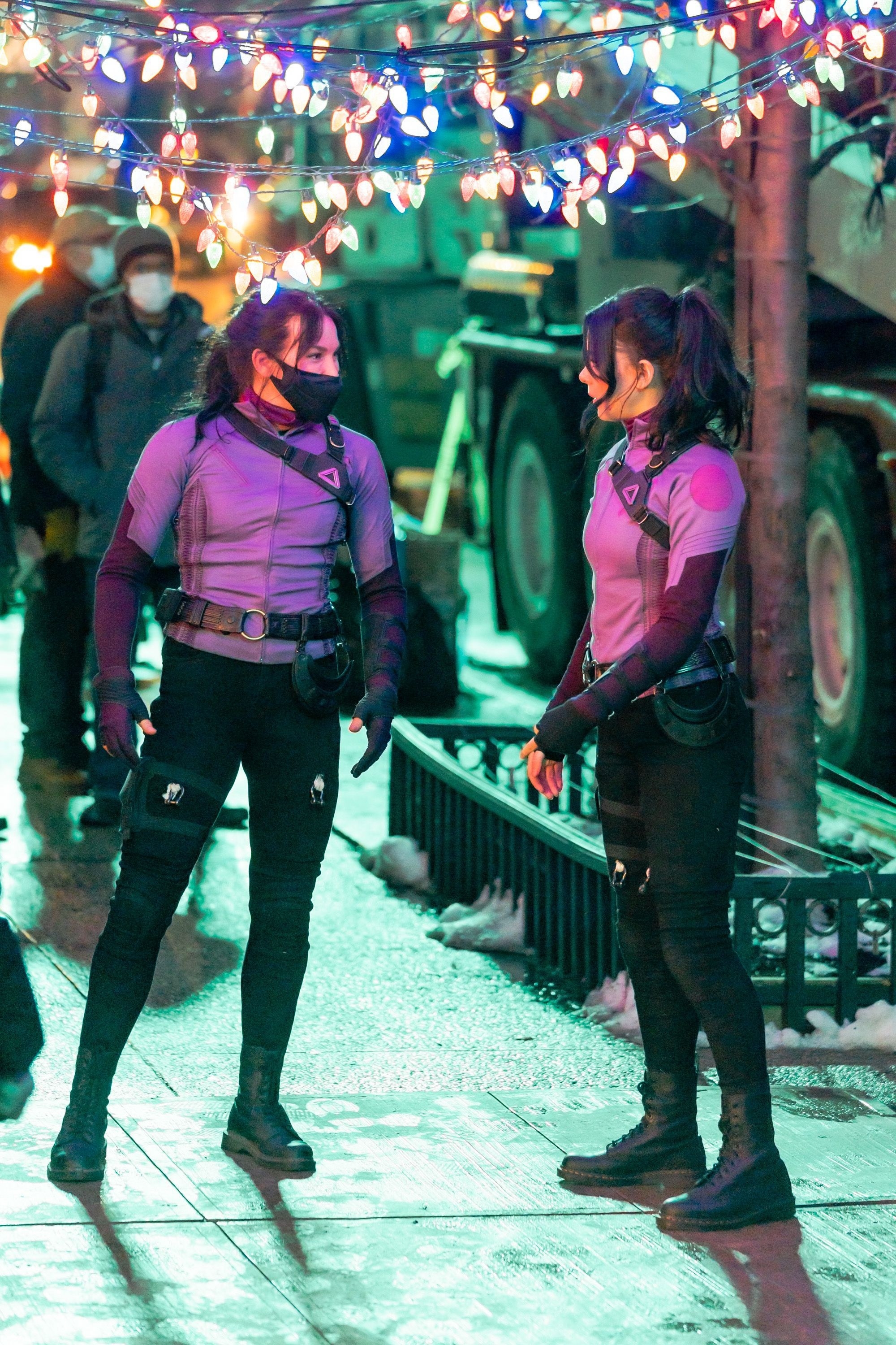 Hailee Steinfeld and her stunt double filming at night outdoors