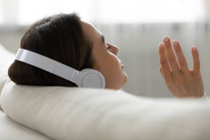 Woman listening to music on headphones