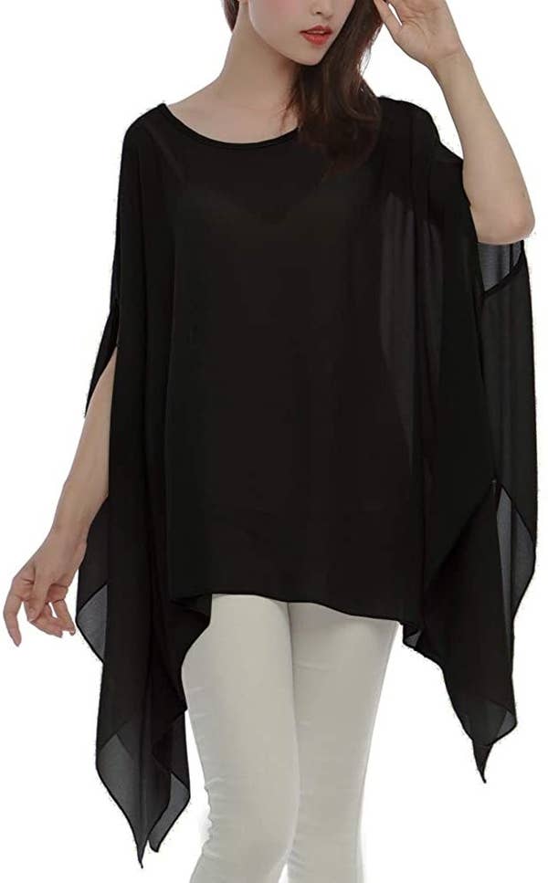 a model wearing the black tunic