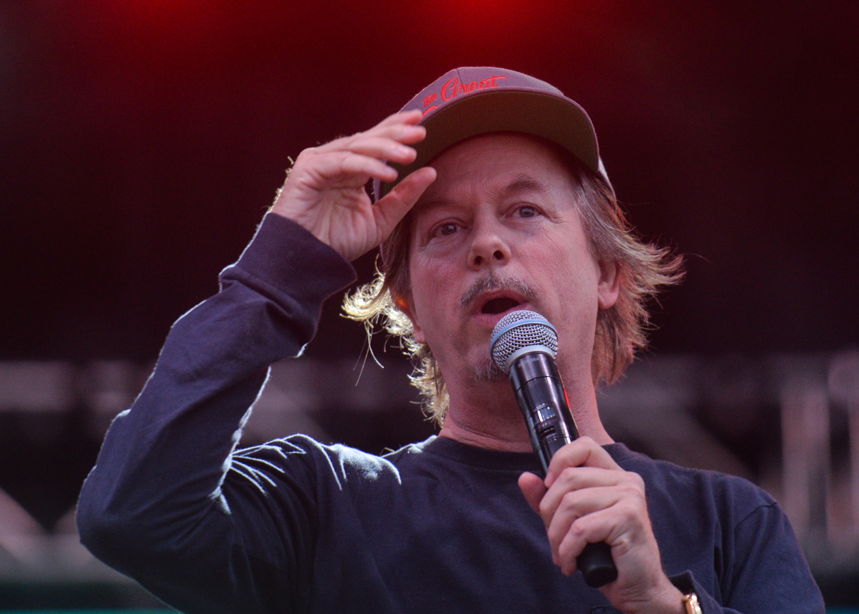 David Spade tipping his hat