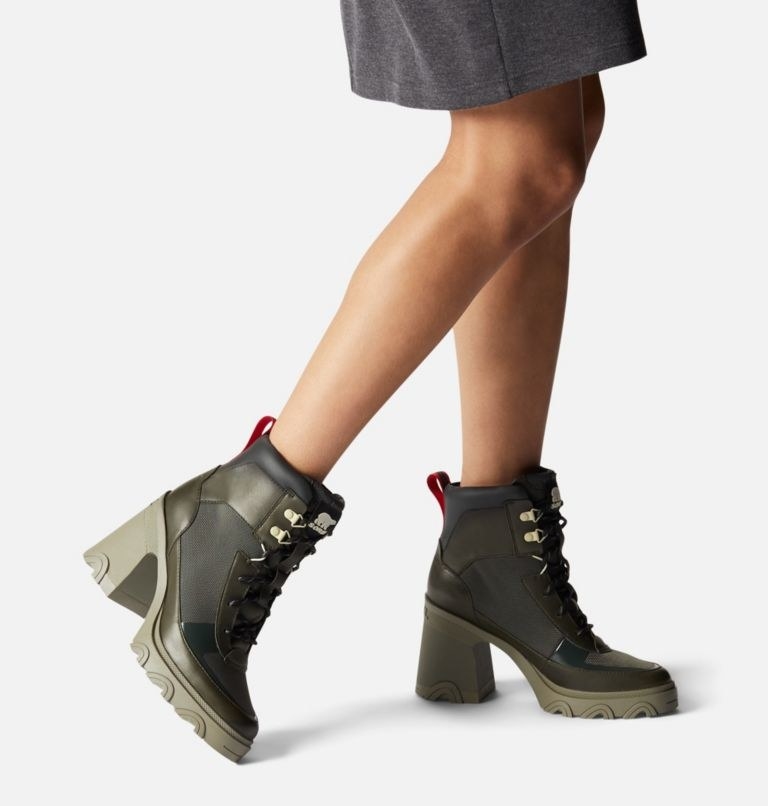 model wearing the chunky heel lace-up boots in olive green