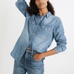 a model wearing the denim button up