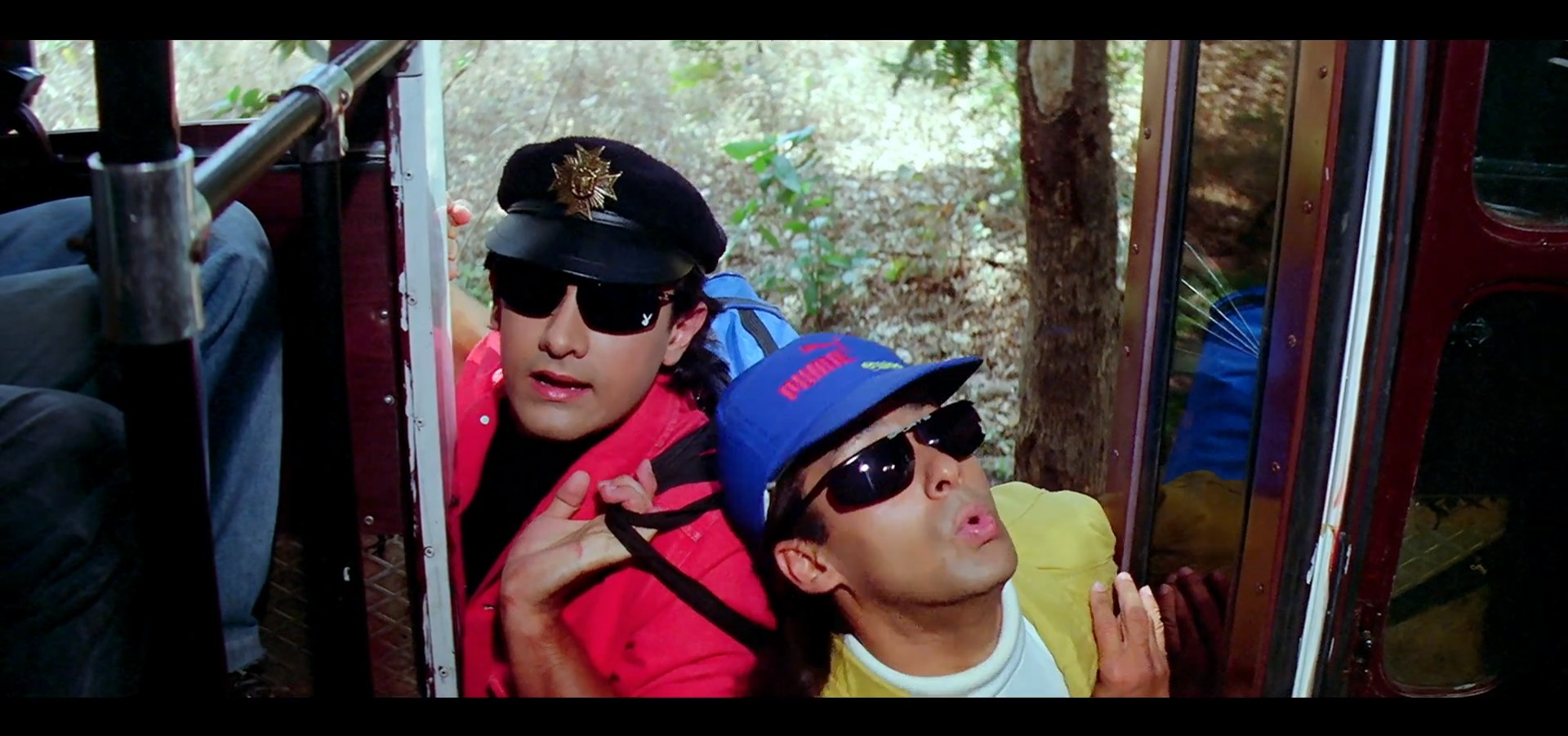 Amar and Prem trying to enter a bus at the same time