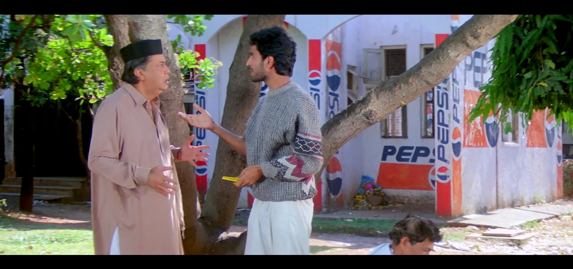 Amar&#x27;s father look shocked while talking to his employee