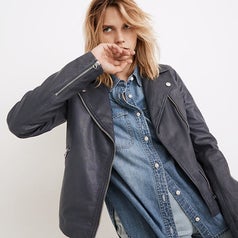 a model wearing the leather motorcycle jacket 