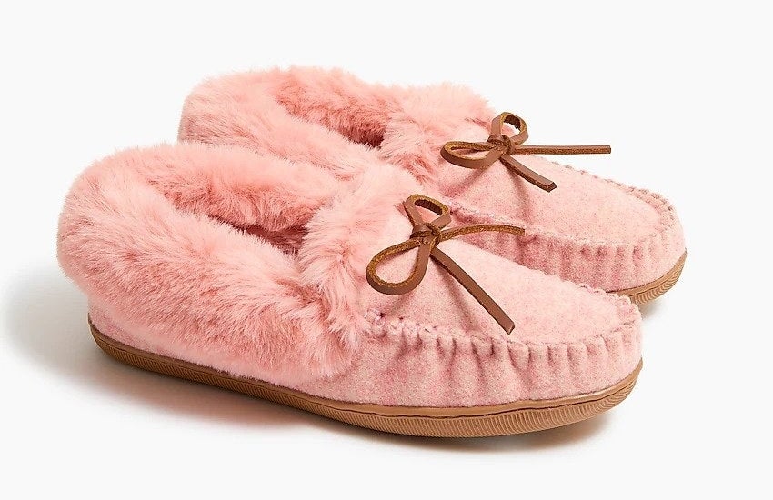 pink faux shearling moccasin slippers with bow detail on front
