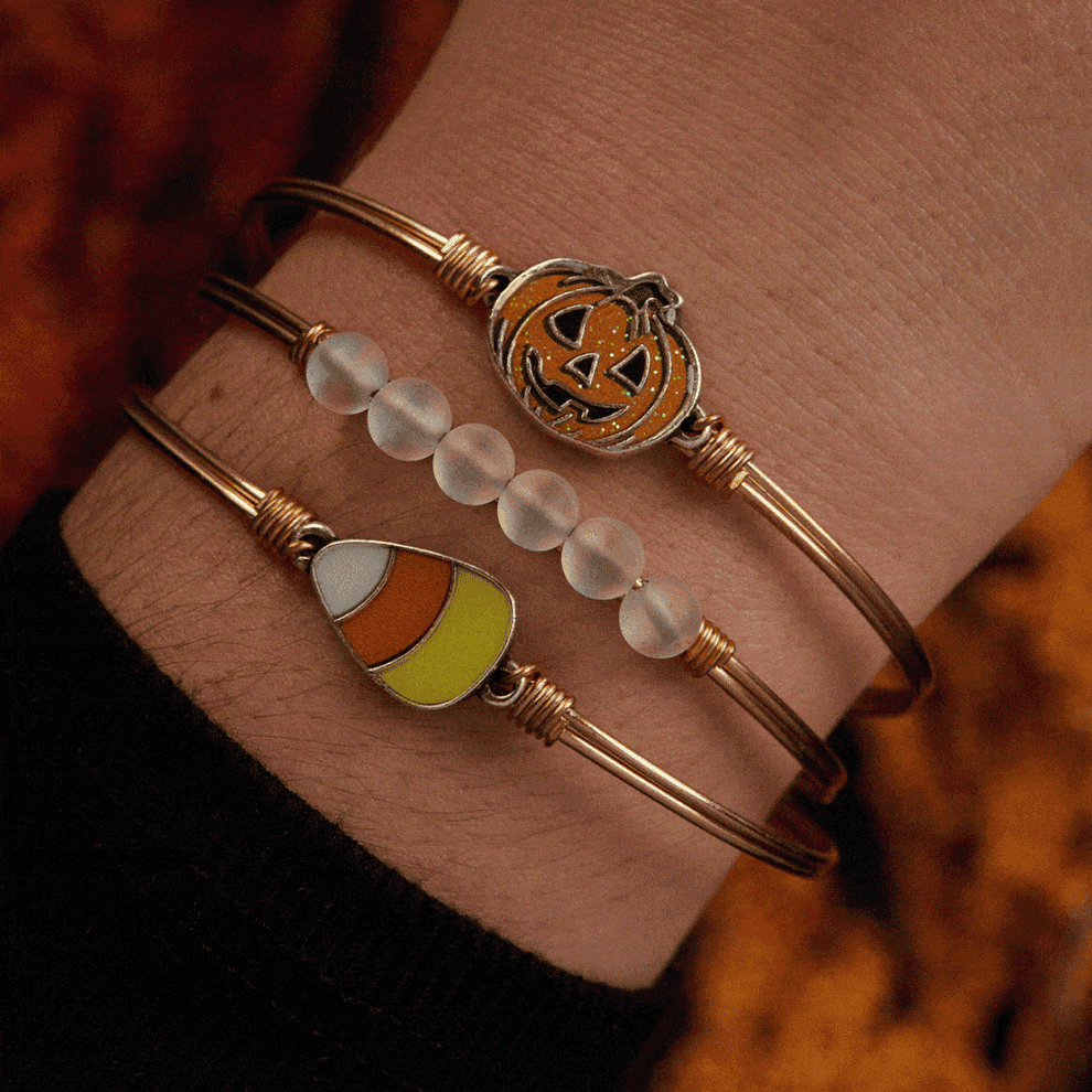 GIF of the glow in the dark Jack O lantern and candy corn bracelet