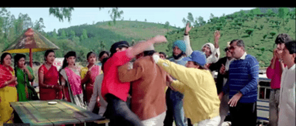 A GIF of a fight between Amar and Prem as others join in and both of them escape from the mob
