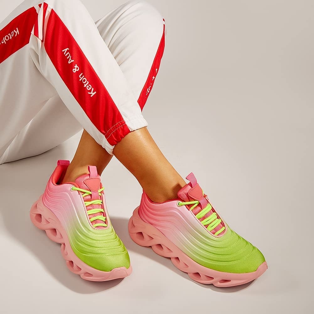 model in pink and neon green ombre chunky sneakers