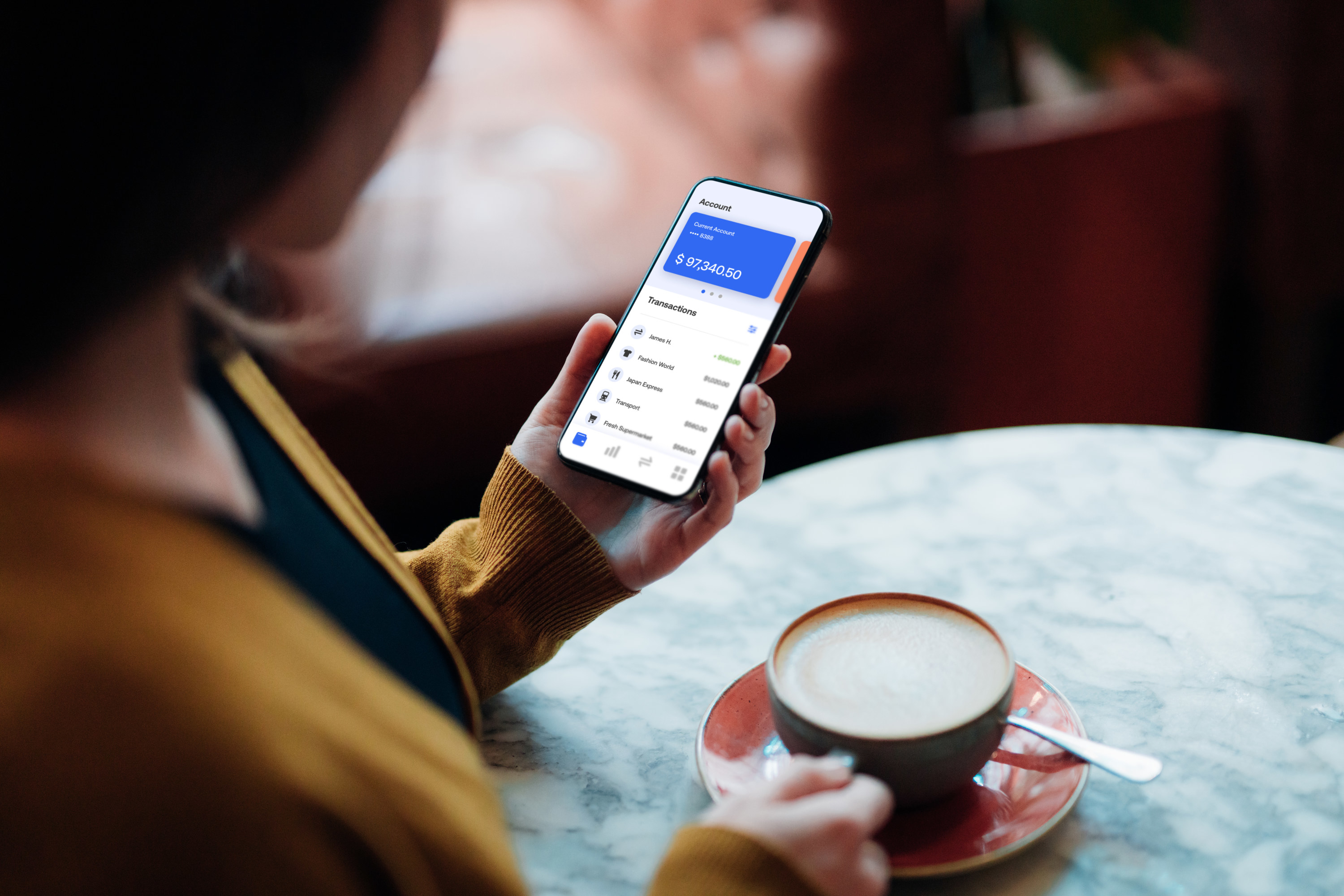 Woman looking at her bank app on her phone