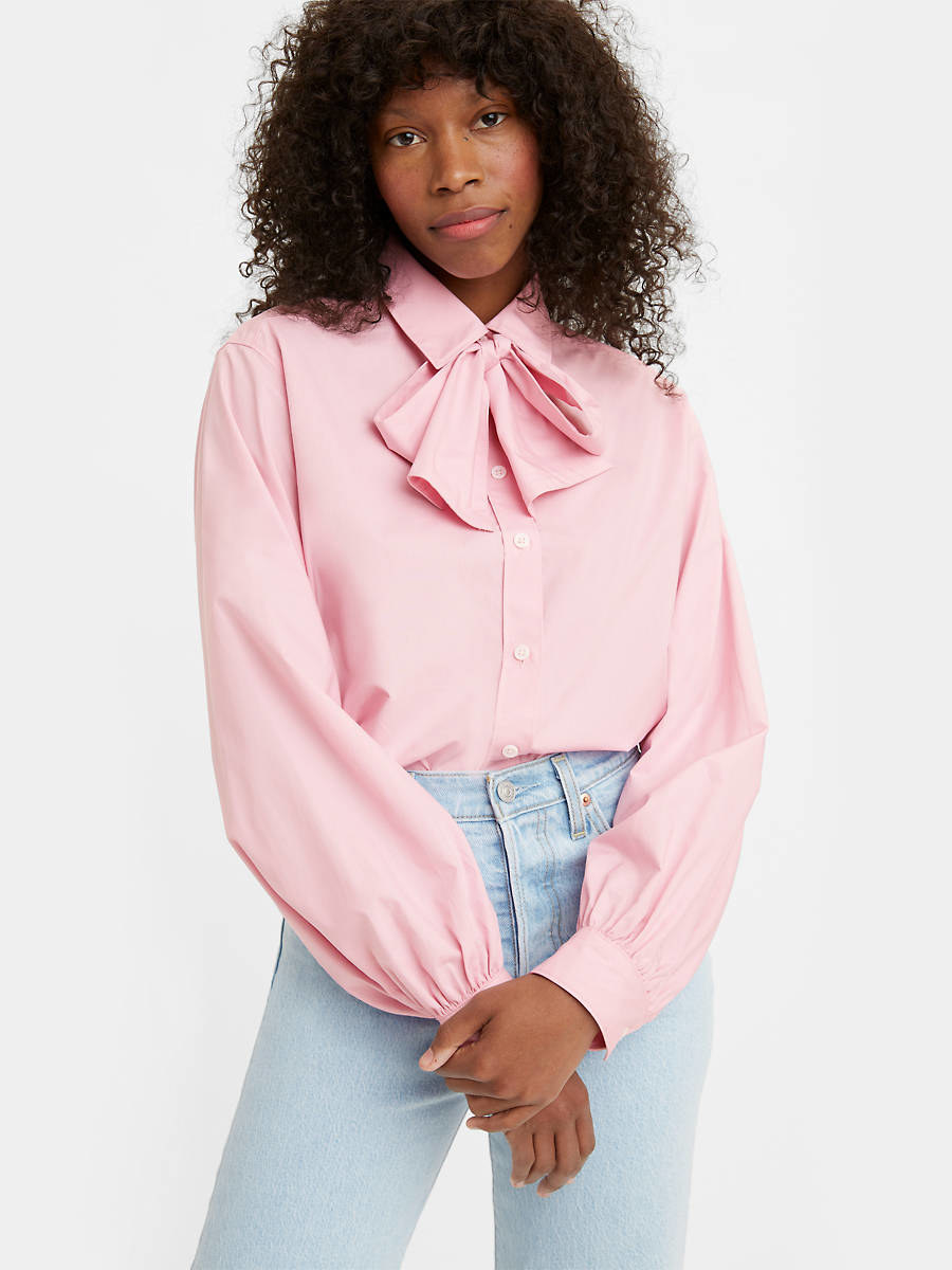 model in long sleeve collared pink blouse