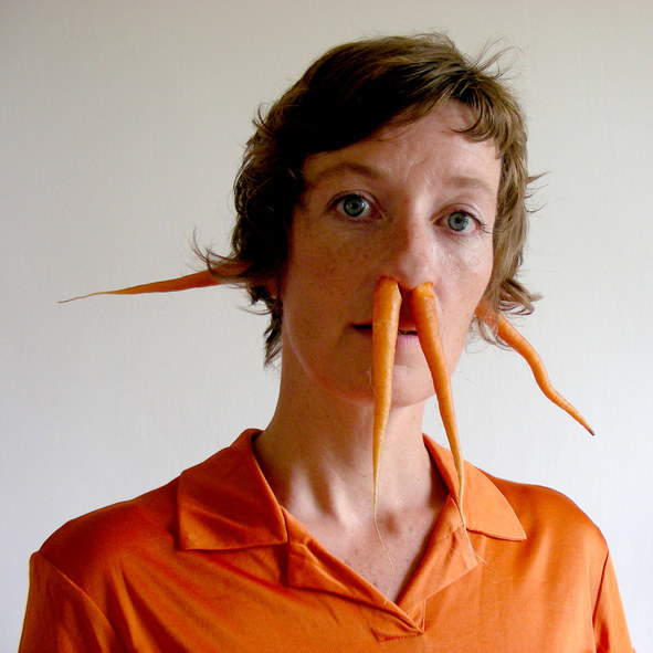 woman with carrots coming out of her nose and ears