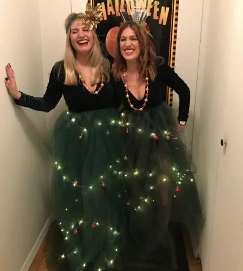 Two people with green lace flowing down as a tress with working lights attached