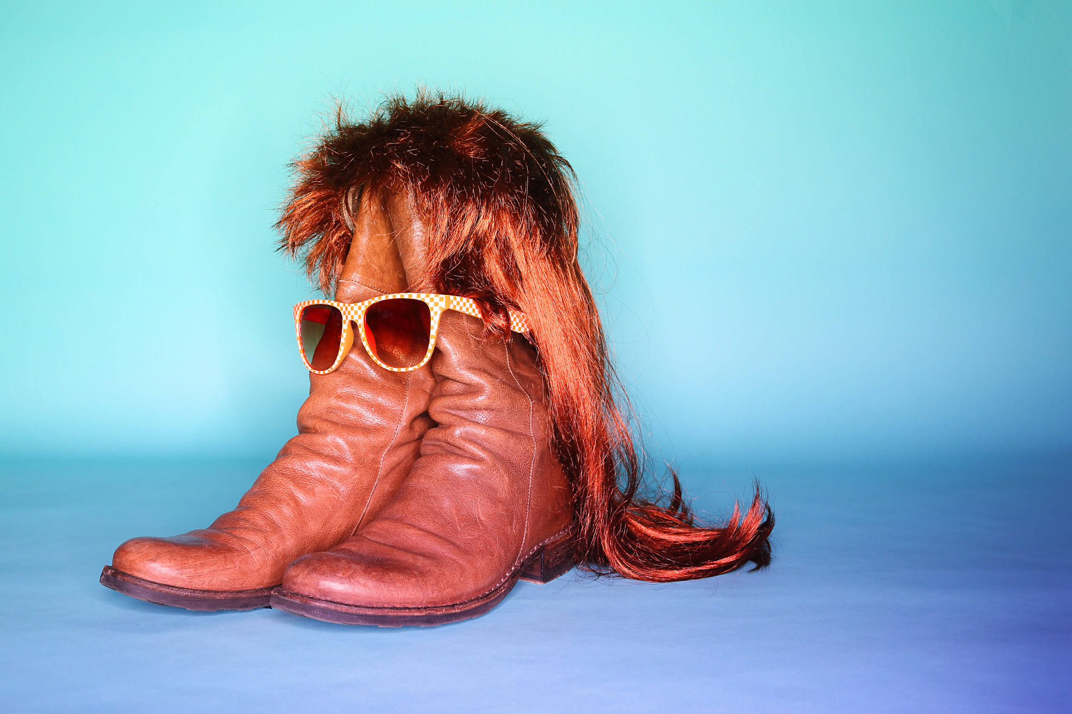 boots with a mullet and sunglasses