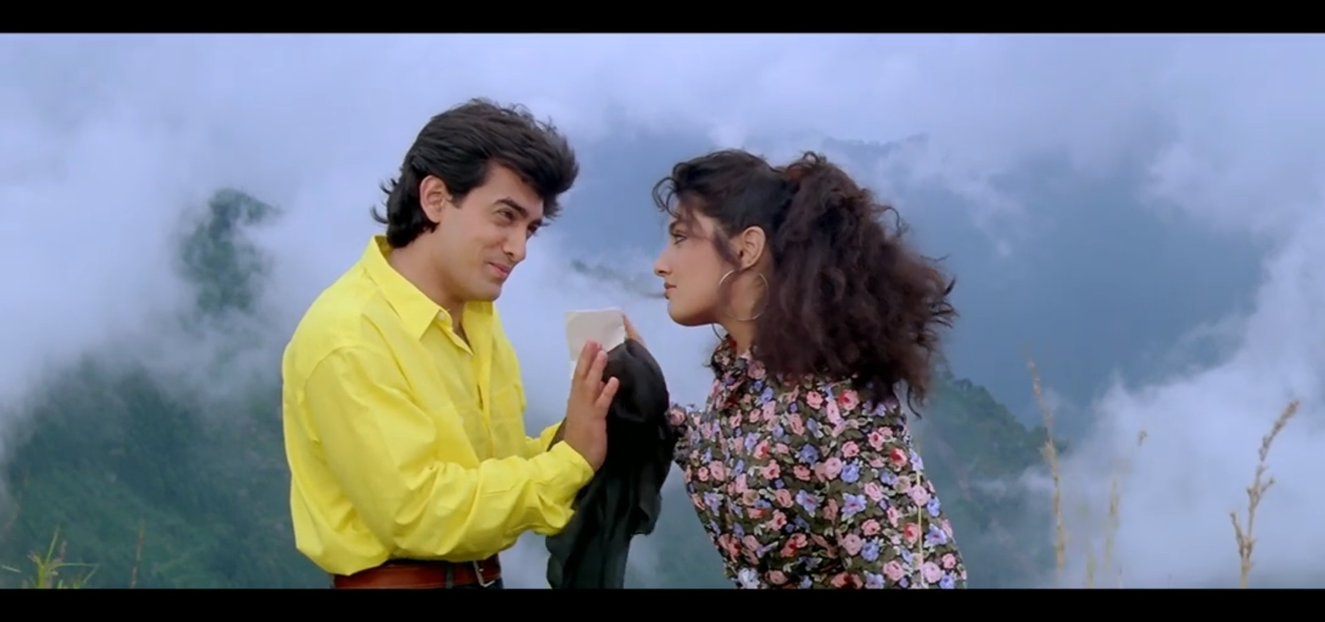 Amar laughing while Raveena looks at him with fake annoyance
