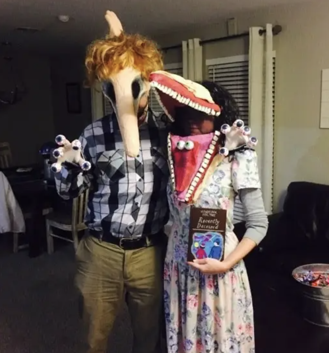 Two people dressed as the monster parents from &quot;Beetlejuice&quot;