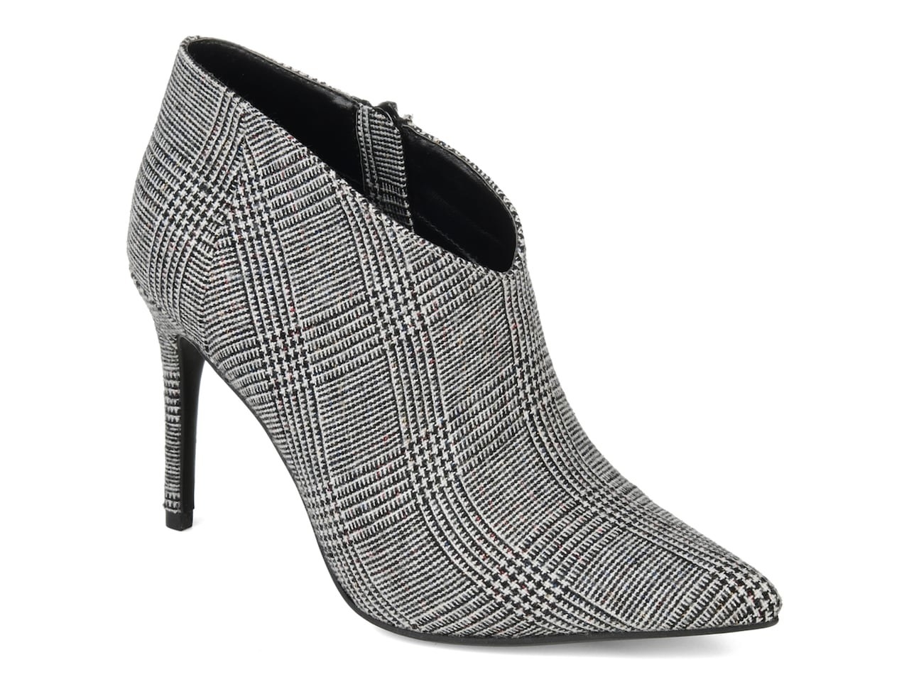 An ankle length bootie heel with a pointed toe and a grey and black houndstooth pattern all over it