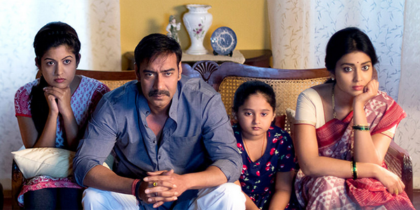 A still of Vijay and his family watching television