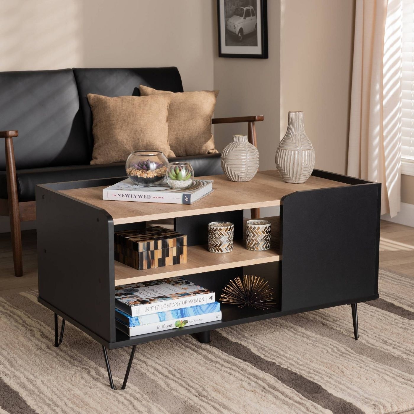 the black and brown coffee table with an interior shelf