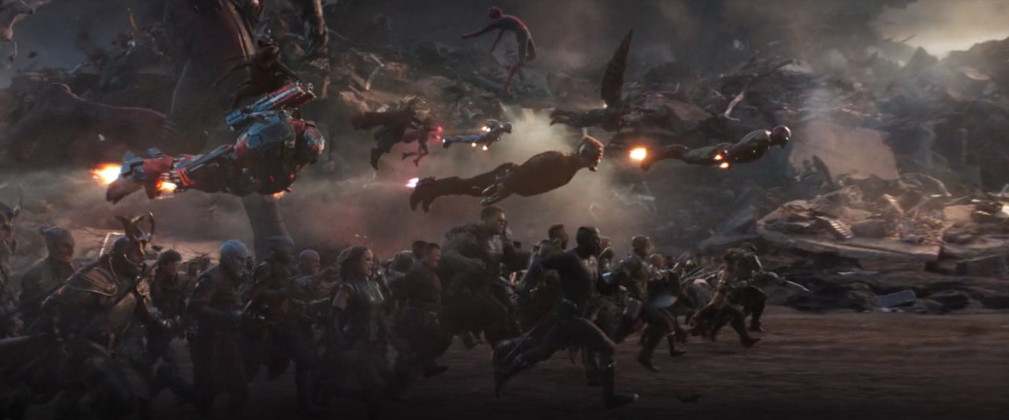 the legion of heroes stampedes towards Thanos