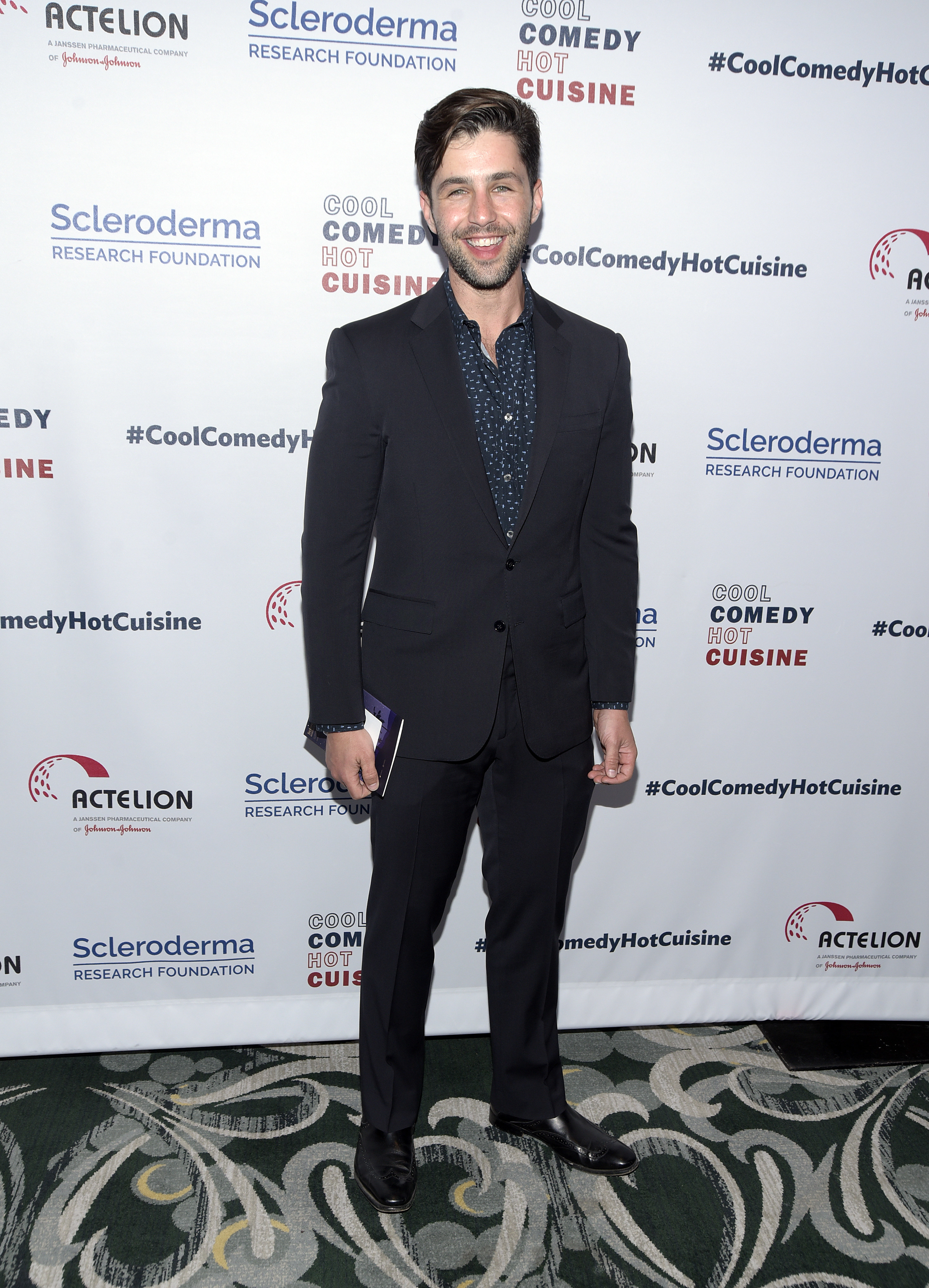 Josh smiling on the red carpet