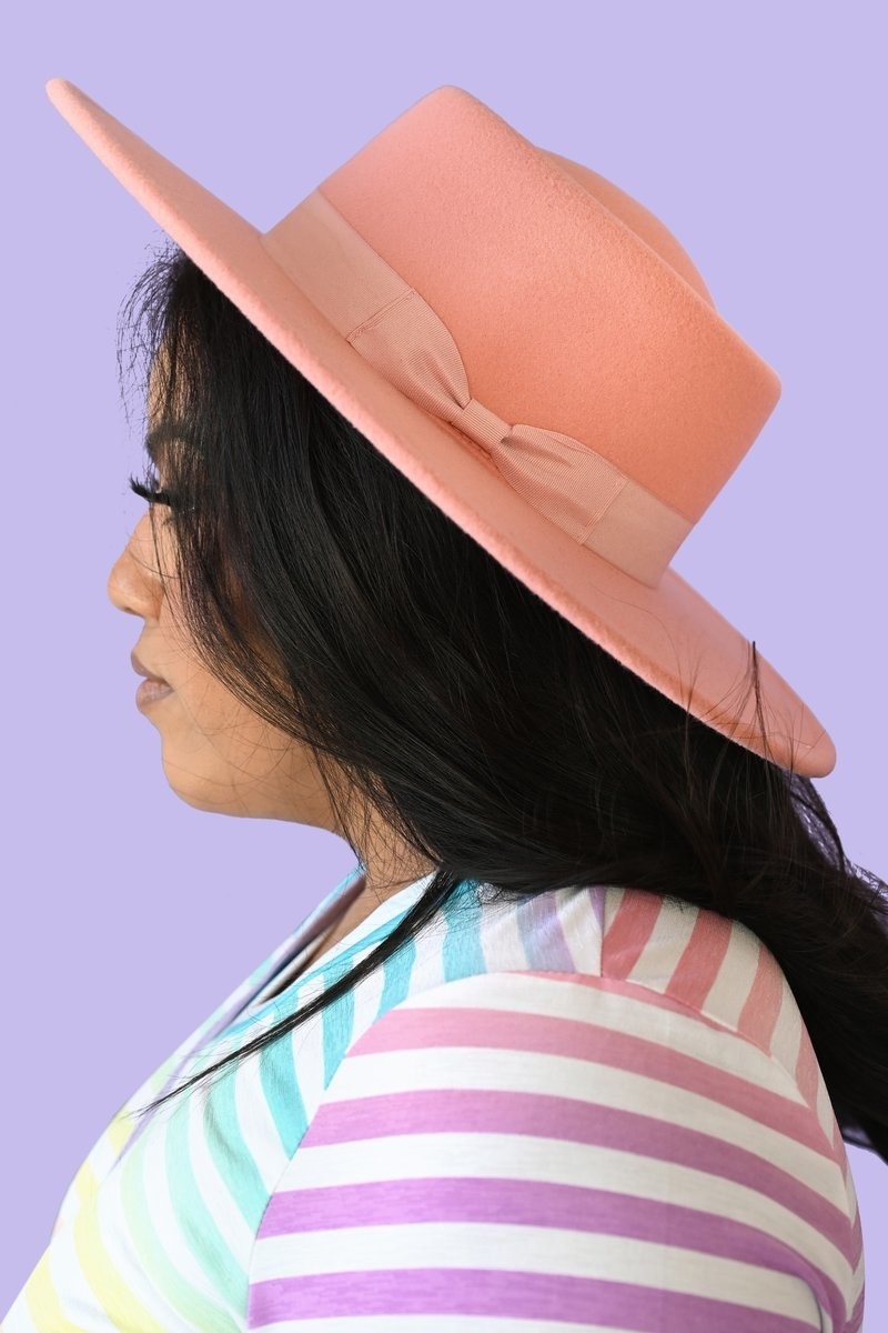 A model in the peach hat
