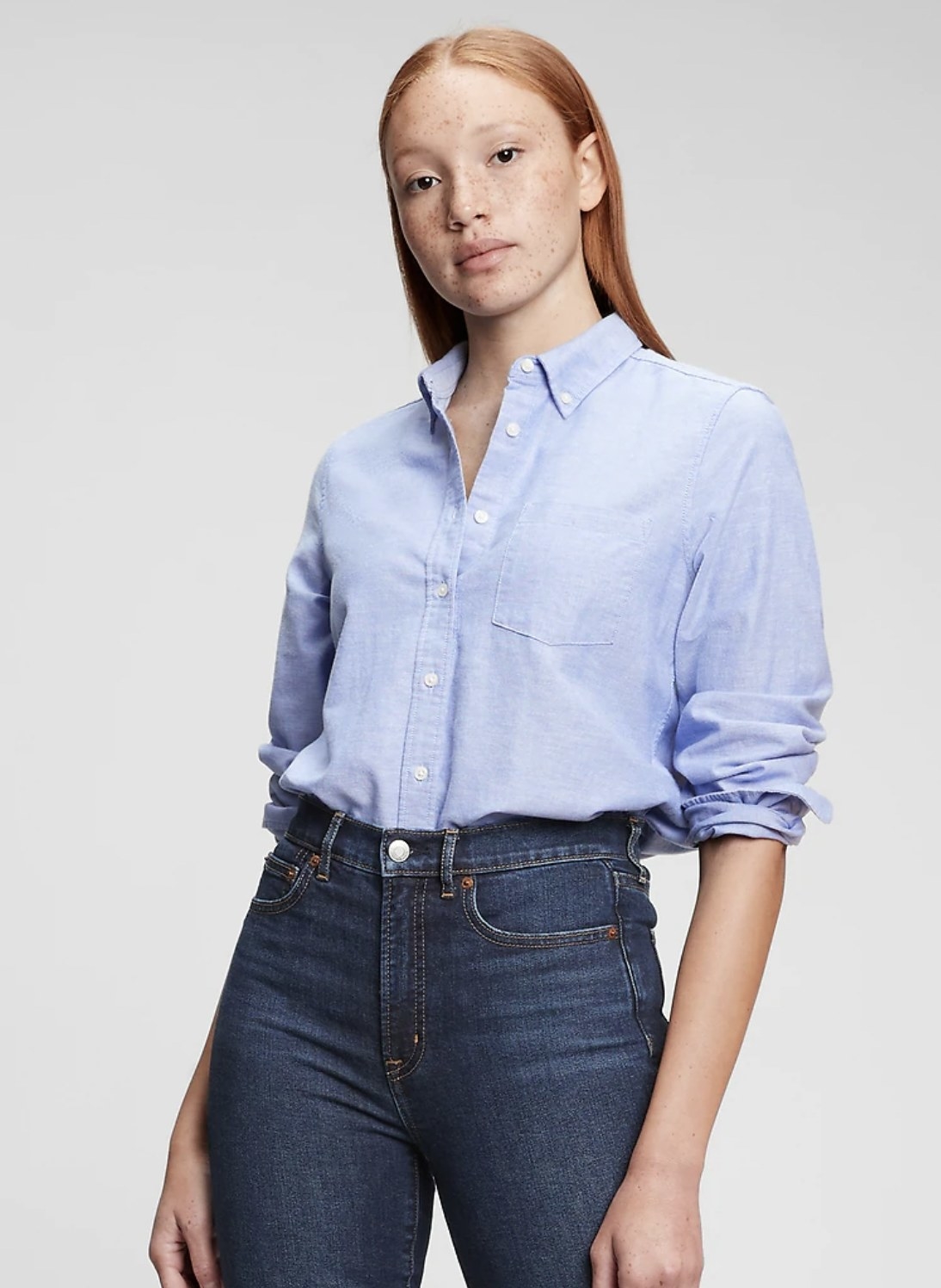 model wearing an oxford shirt in blue