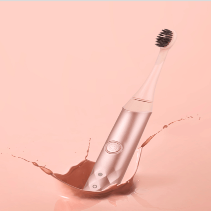 the toothbrush in rose gold
