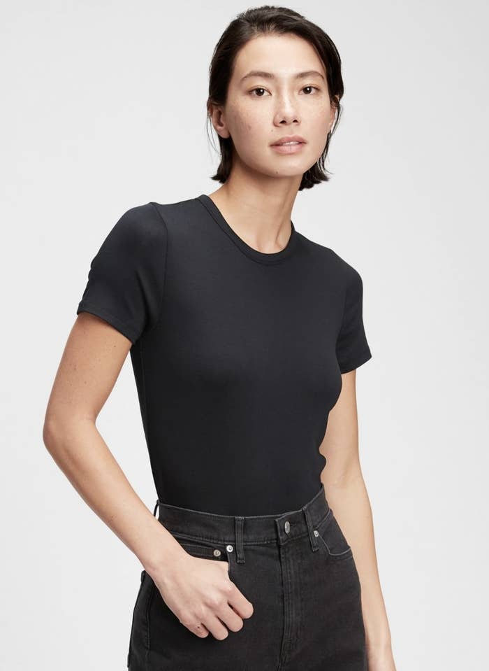 the model wearing a black t-shirt