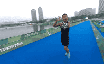 runner high-fives camera