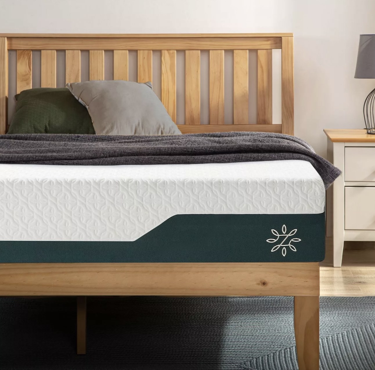 the mattress on a bed frame in a room
