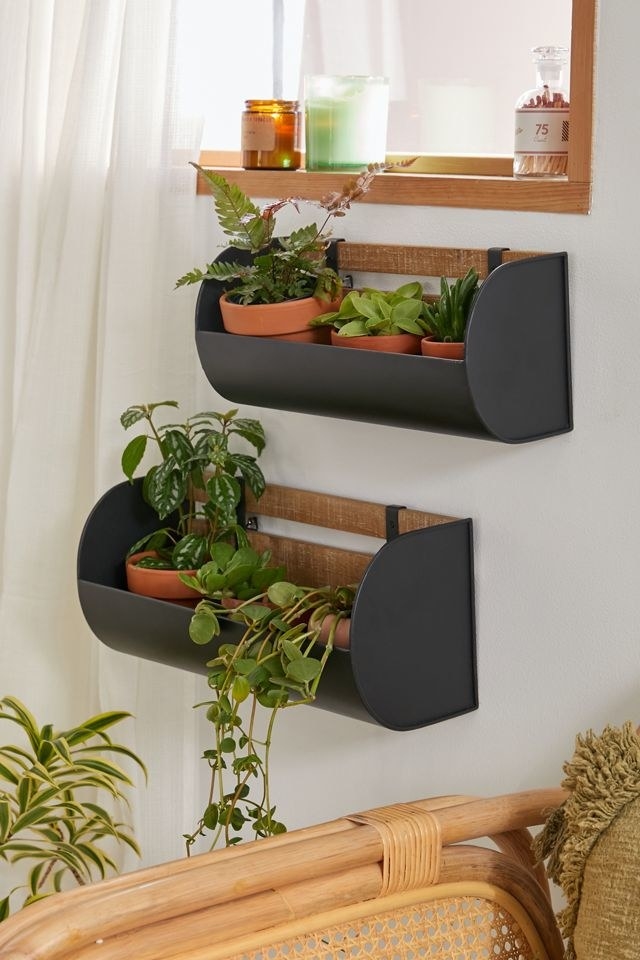 The black and wood planters inside
