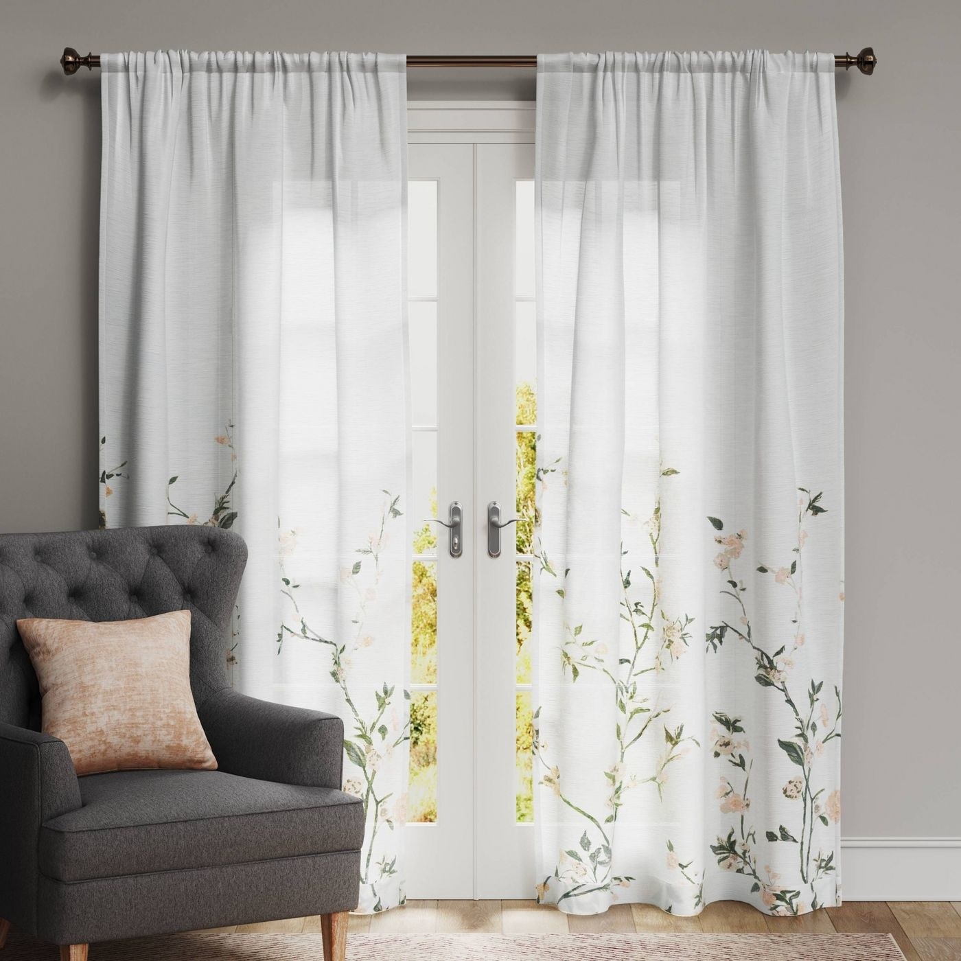 the white patterned curtain next to a chair