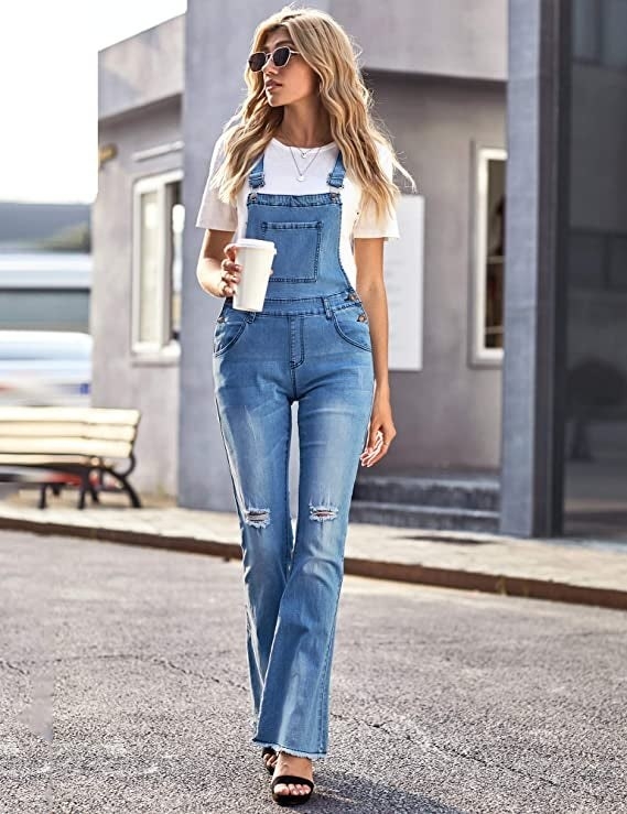 model wearing overalls with flared pant bottoms