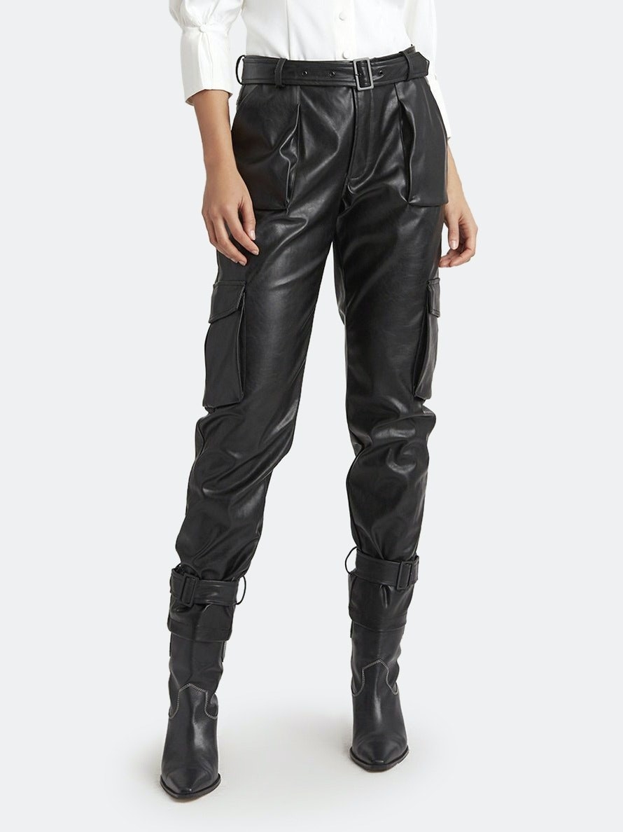 model wearing black leather pants with black boots
