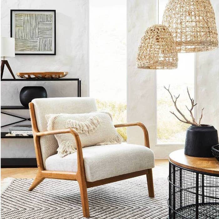 wood armchair with off white cushions
