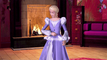 barbie is inside a house in front of a fireplace. she waves a wand over her dress and it is surrounded by stars and magic dust