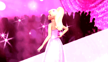 barbie wears a strapless dress with a long skirt while modeling on the runway