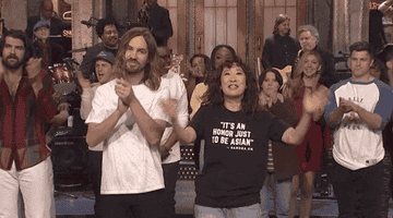 Sandra Oh runs hands through hair on SNL