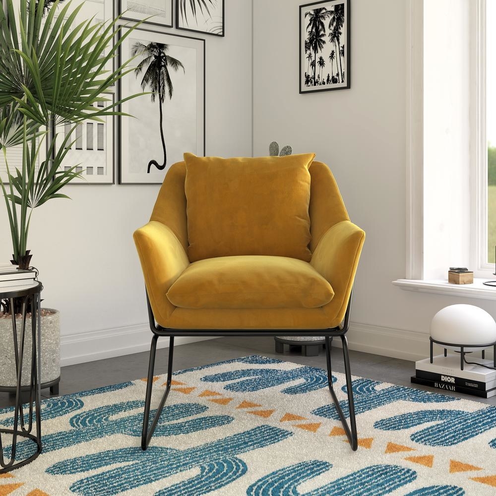 the mustard colored armchair with wire frame base