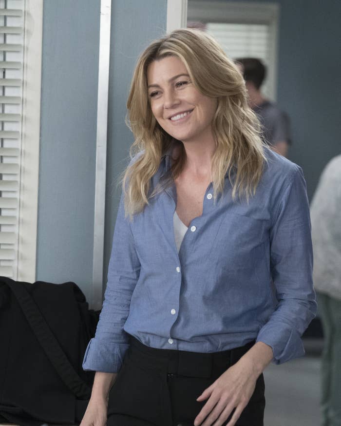 Ellen Pompeo smiles to someone off-camera on Grey&#x27;s Anatomy