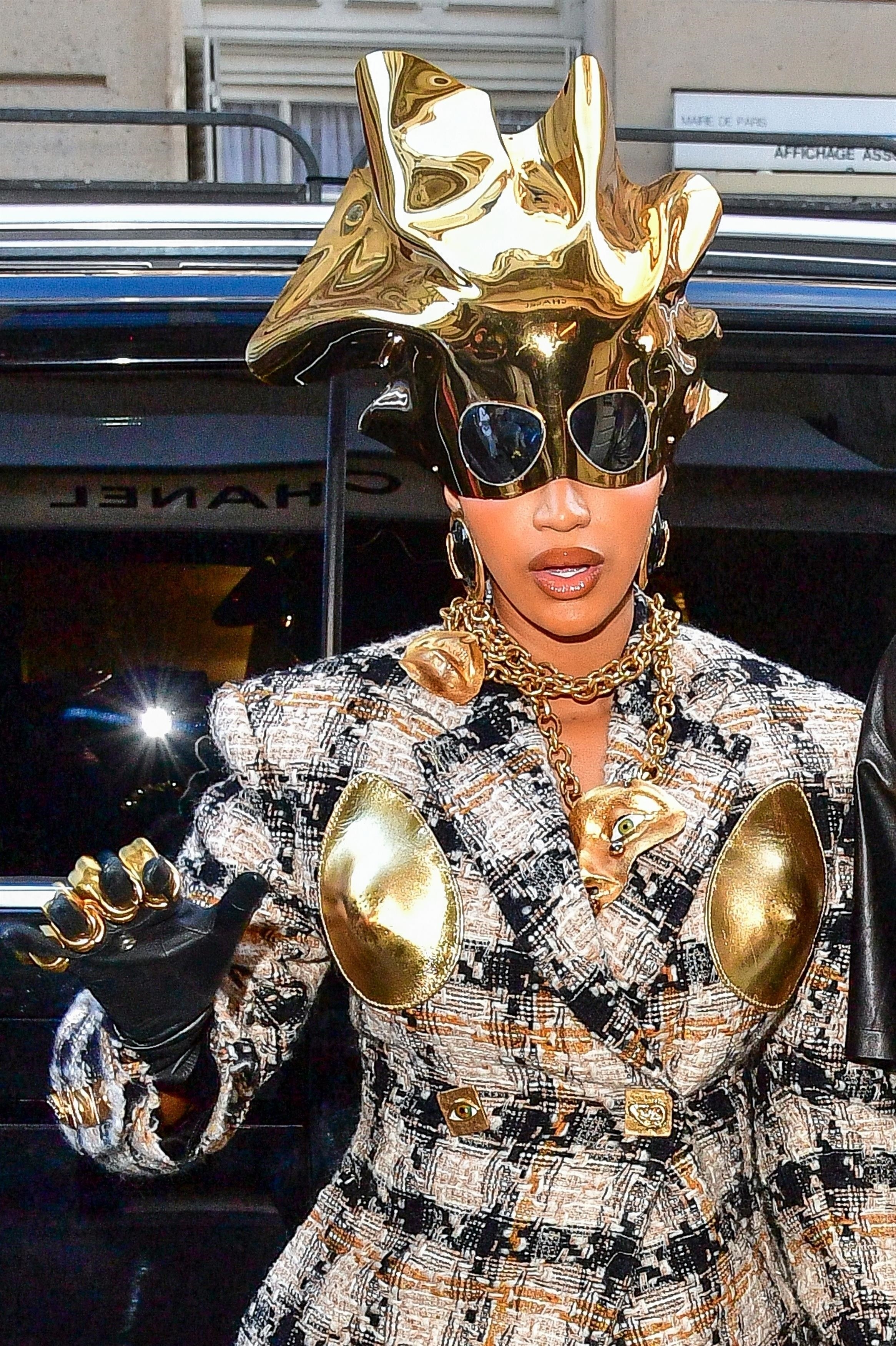 Close-up of Cardi&#x27;s gold headpiece, with attached sunglasses