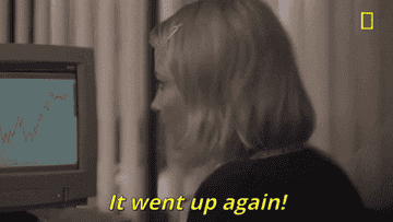 Woman looking at a graph saying it went up again
