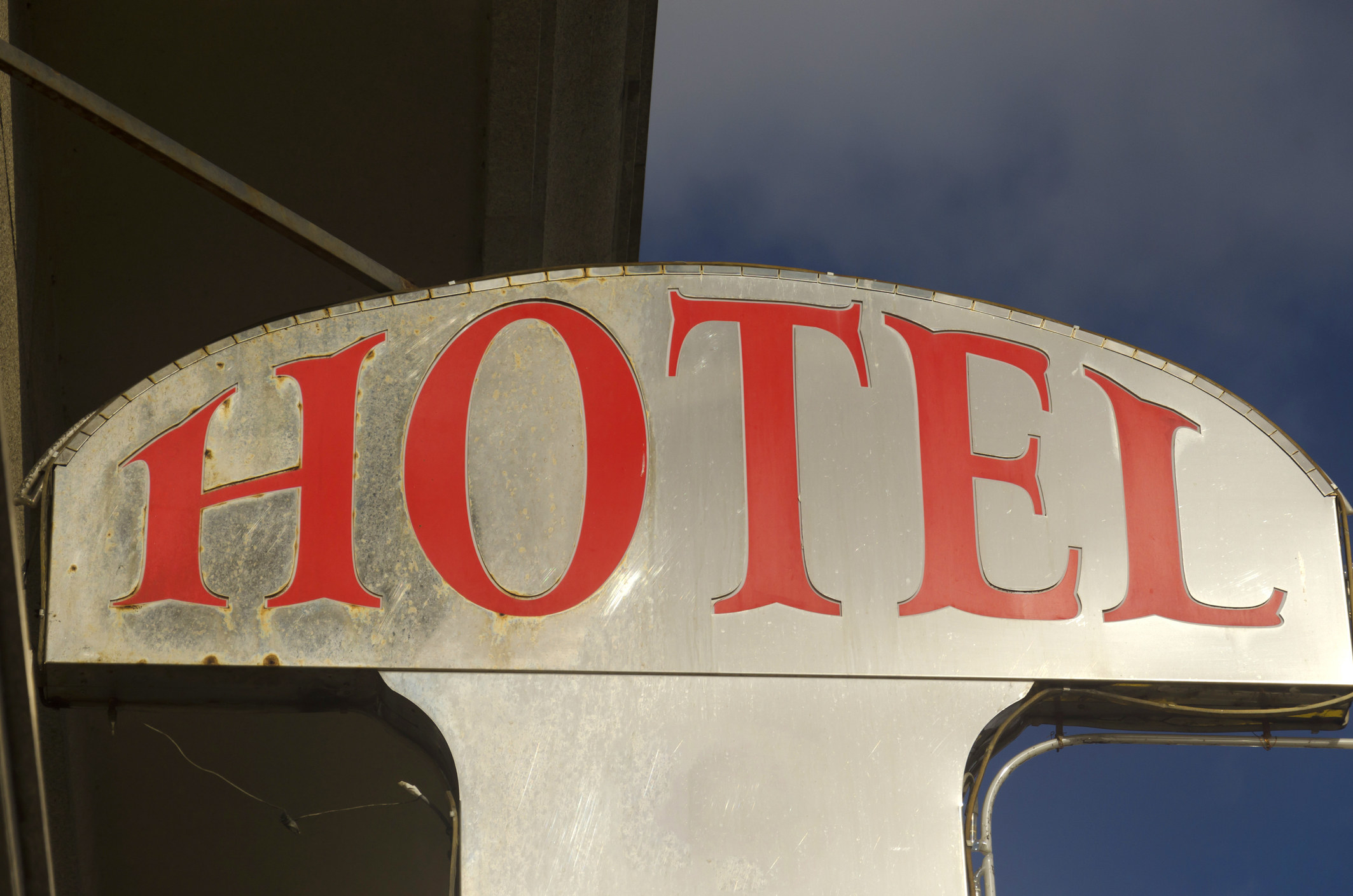 a vintage hotel sign at night